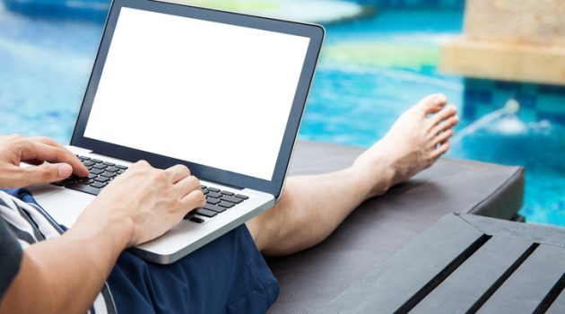 Screen mockup of laptop that a man is using in the pool on vacation - work anywhere and internet work concept